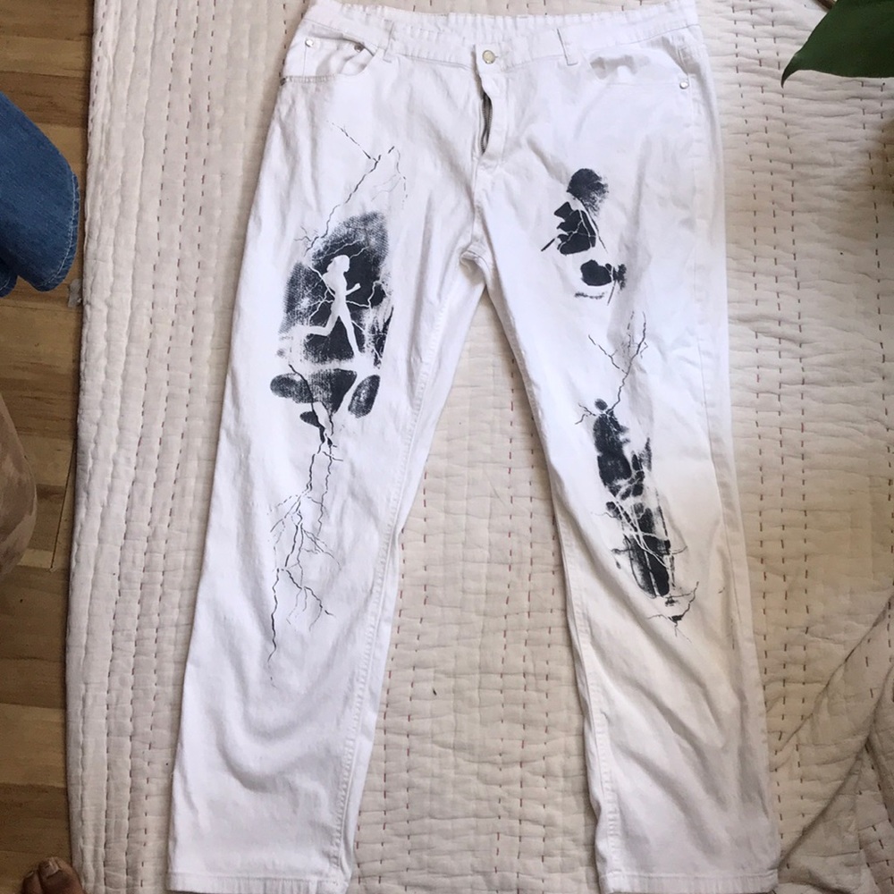 White stretch fit pants with design on them